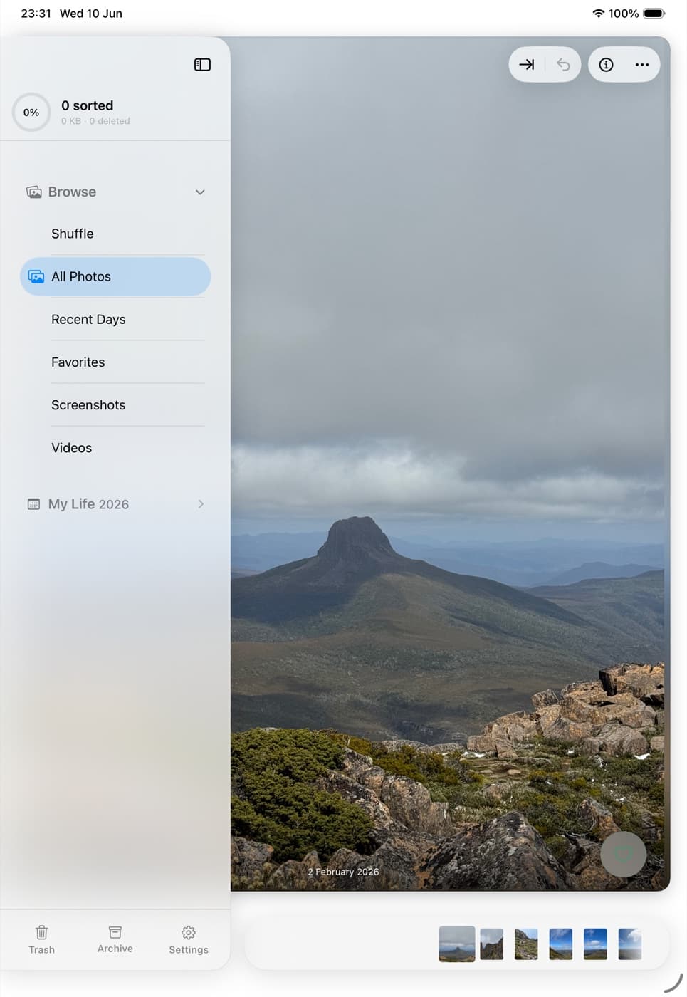 Siftata on iPad in portrait with the sidebar expanded — browse, groups, and the trash dock beside the photo